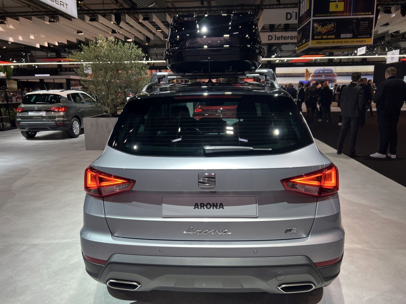 Rear view with LED tail lights and roof box on compact SUV