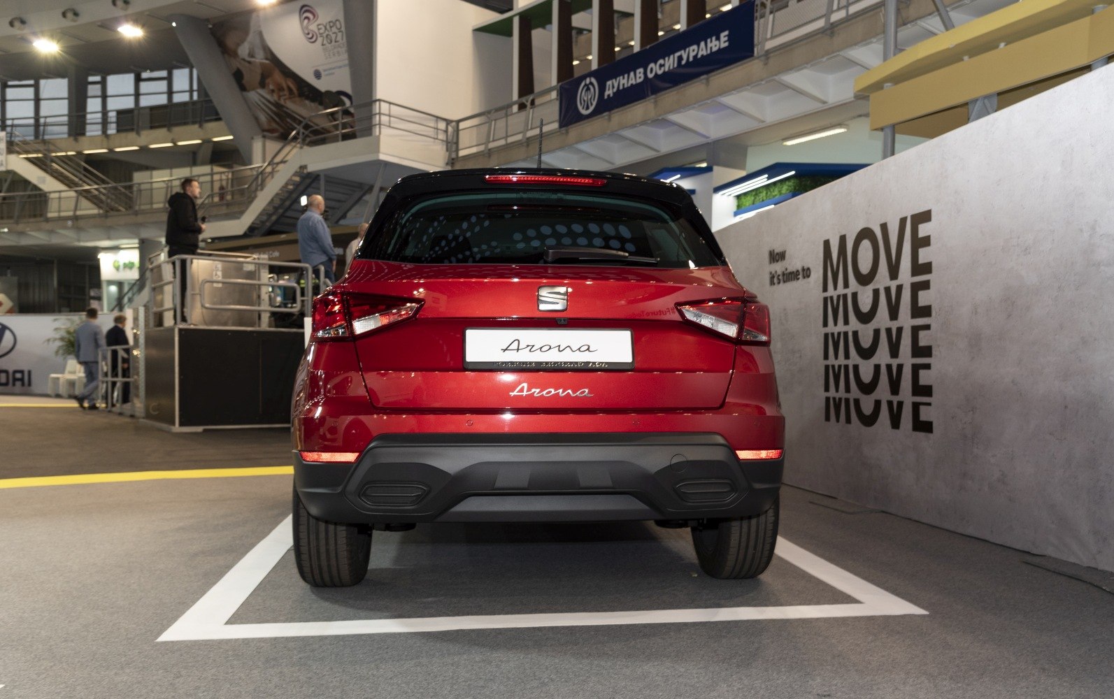 Rear view with sharp tail lights and black lower bumper.