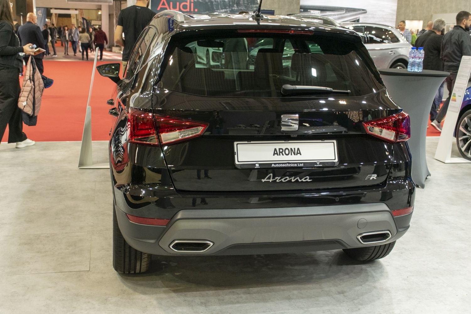 Rear view with LED tail lights, rear window wiper, dual exhaust.