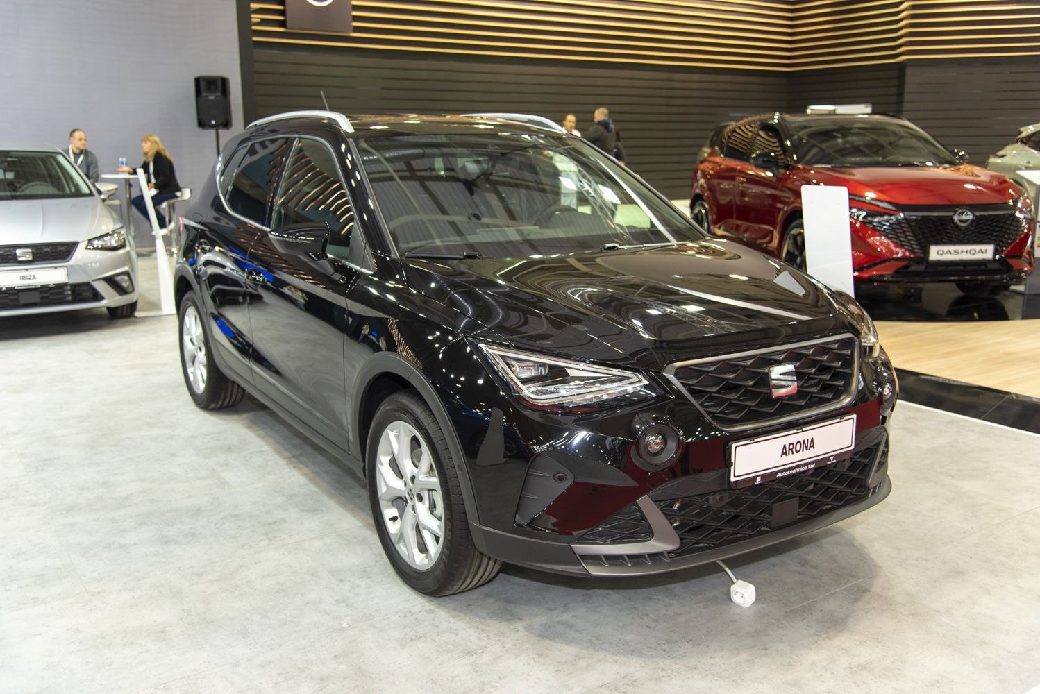 Front view of a black compact SUV with sharp LED headlights and modern grille
