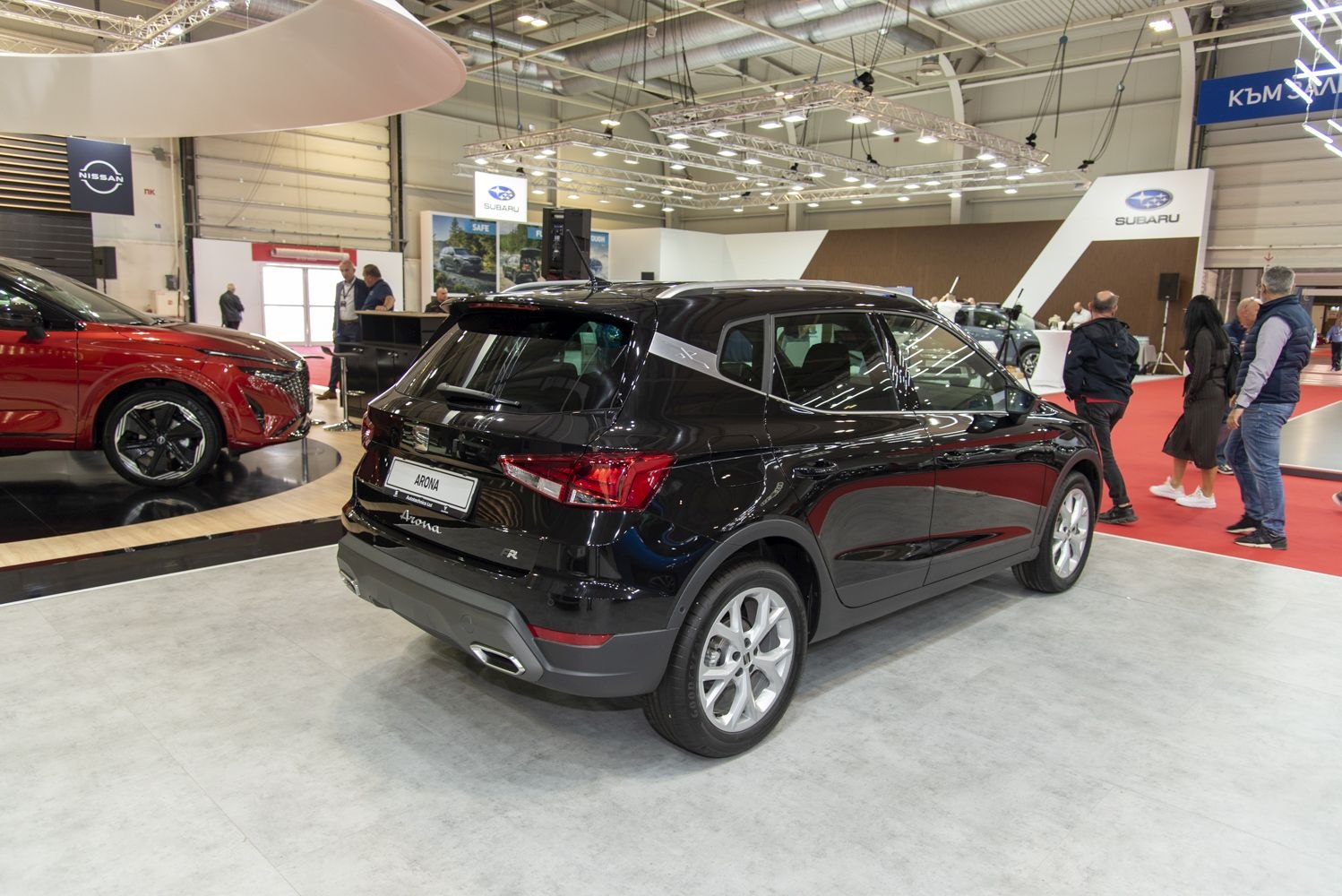 Rear view of modern compact SUV with sporty dual exhausts and distinctive tail lights