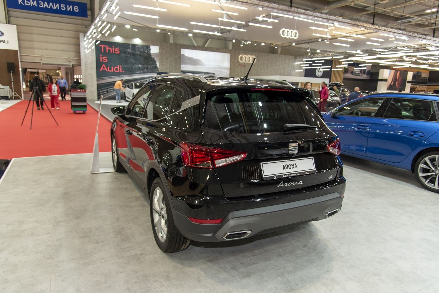 Rear view of a black compact SUV with modern tail lights and dual exhaust outlets