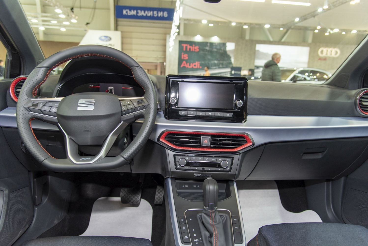 Modern steering wheel and digital dashboard with infotainment screen