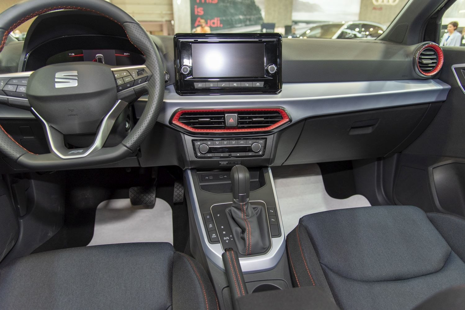 Modern car dashboard with touchscreen and sporty steering wheel