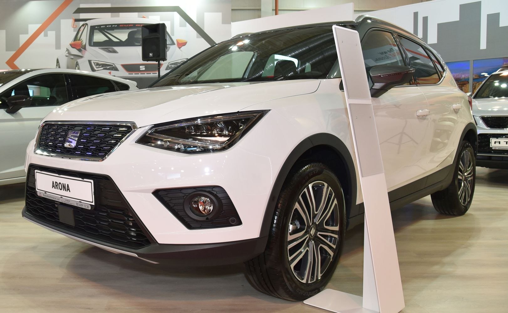 Sharp LED headlights and front grille with alloy wheels on a compact SUV