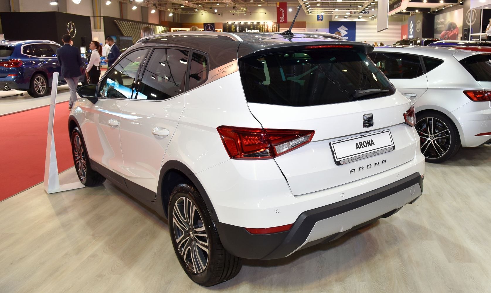 White compact SUV rear view with alloy wheels and roof rails