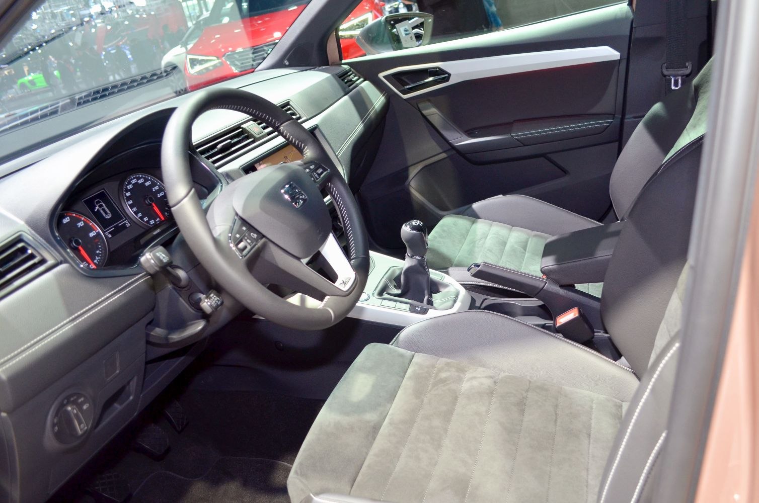 Interior with dashboard, manual gear shift, and seat design