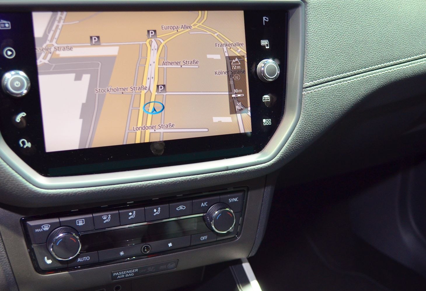 Touchscreen navigation system and climate control panel with buttons and knobs
