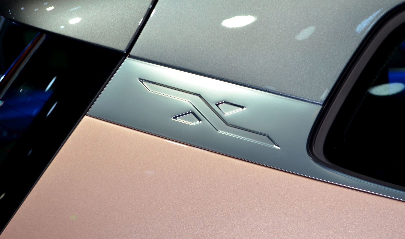Close-up of distinctive side emblem on car door panel