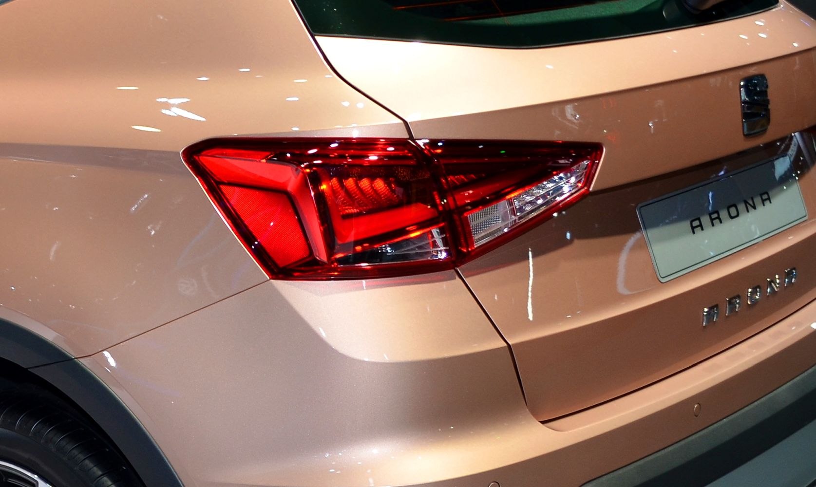 Close-up of rear tail light and badge on vehicle rear quarter panel