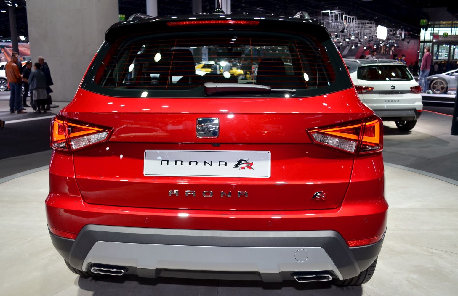 Rear view with distinctive tail lights and dual exhaust