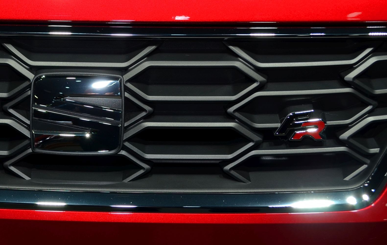Close-up of SEAT vehicle grille with logo and FR badge