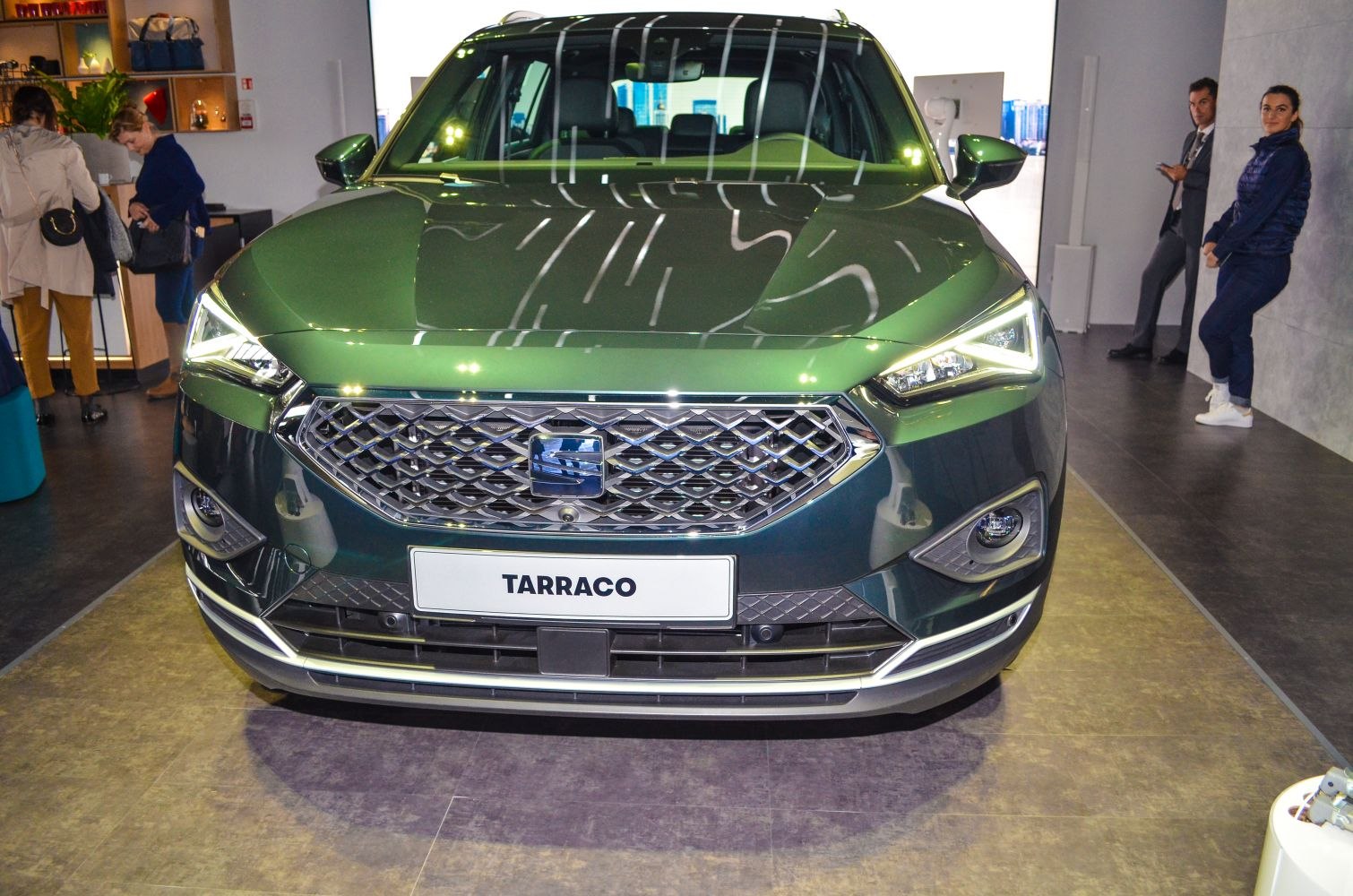 Front view of SUV with modern headlights and diamond-pattern grille
