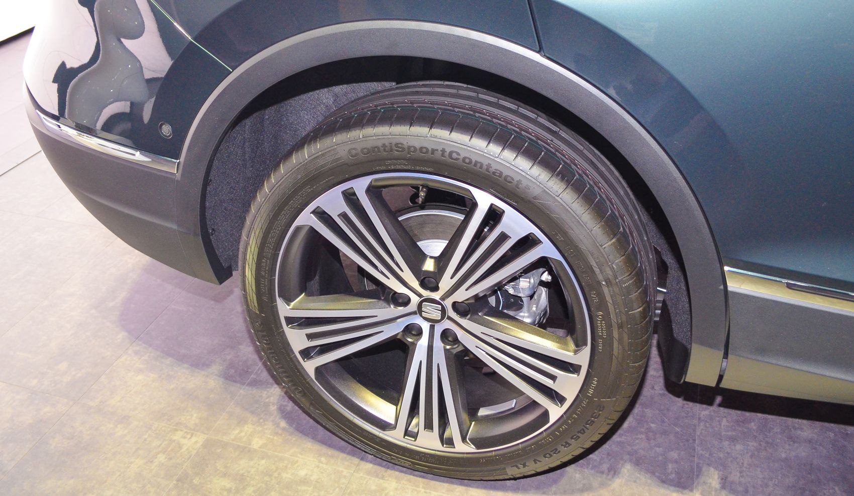 Detailed alloy wheel with modern spoke design and Continental tire.