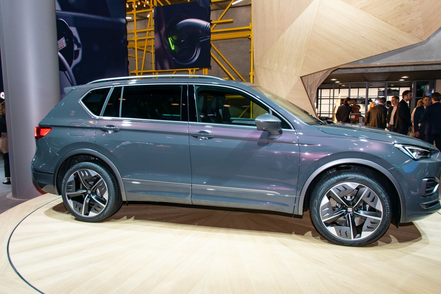 Side profile of modern SUV with alloy wheels and roof rails