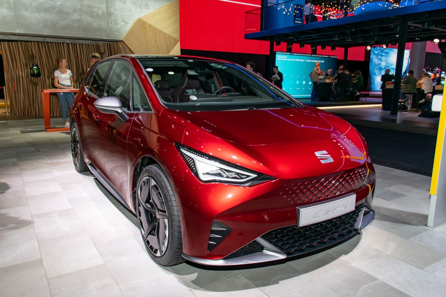Red electric hatchback with LED headlights and sporty alloy wheels