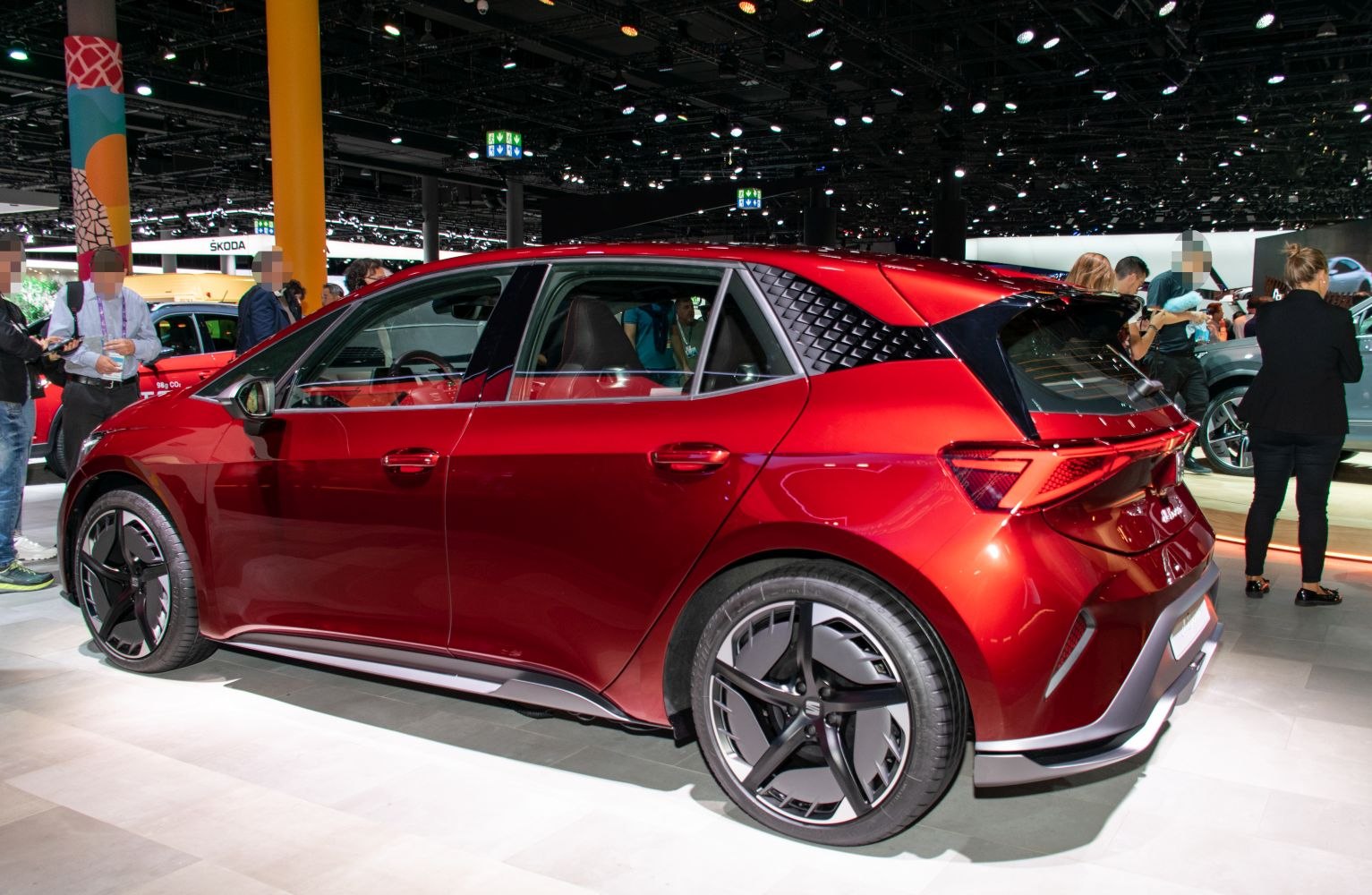 Modern electric hatchback with geometric rear pillars and futuristic alloy wheels