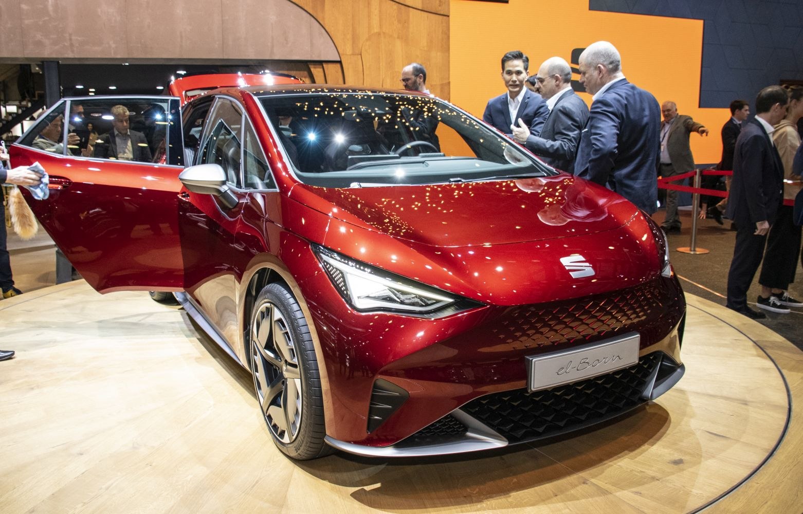 Sleek red hatchback with LED headlights and sporty aerodynamic design