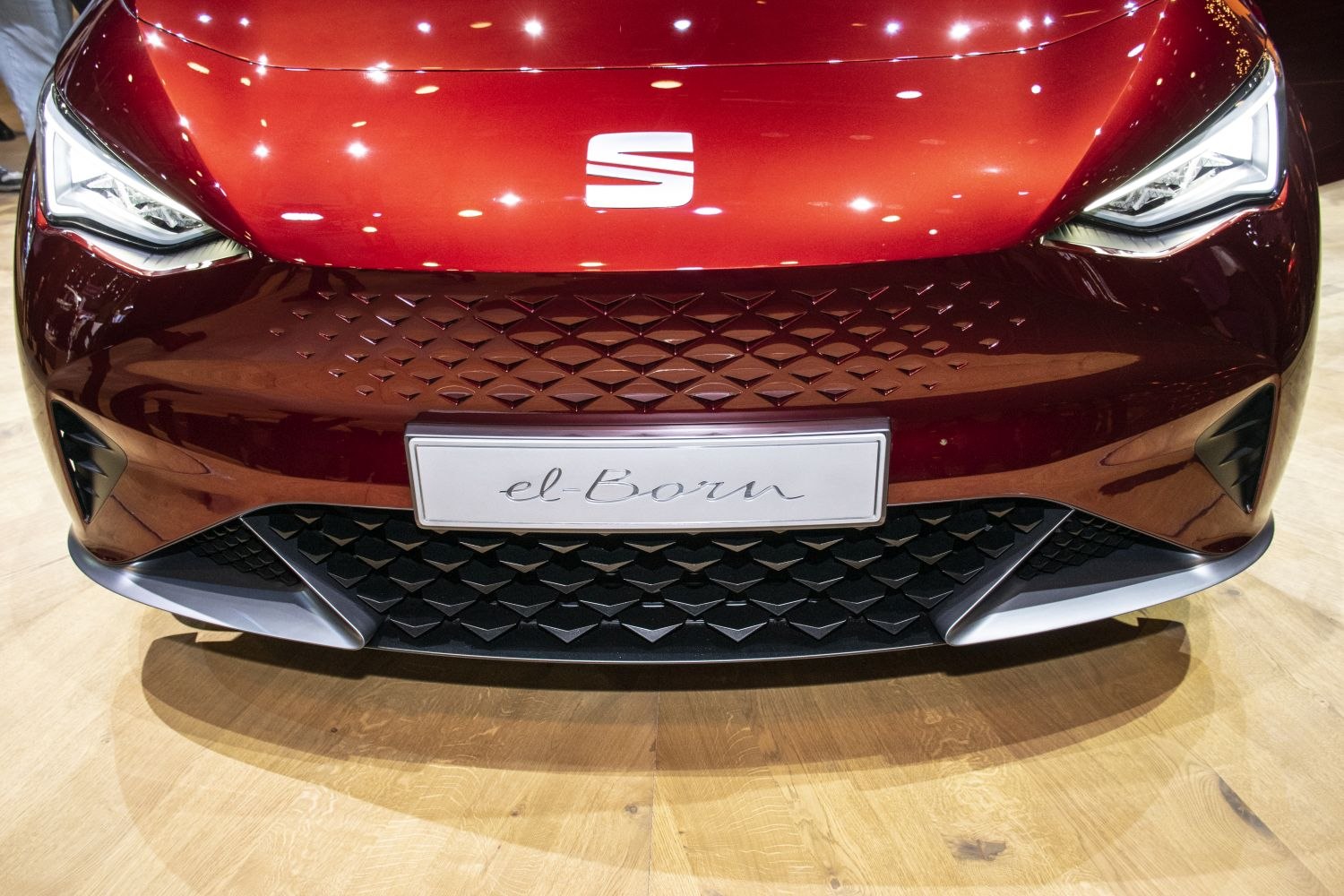 Close-up of front fascia and LED headlights with distinctive grille pattern