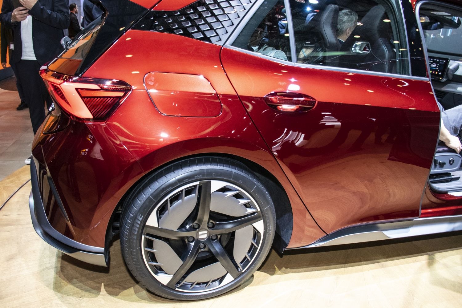 Close-up of rear side profile with sporty wheel and distinct tail light design.