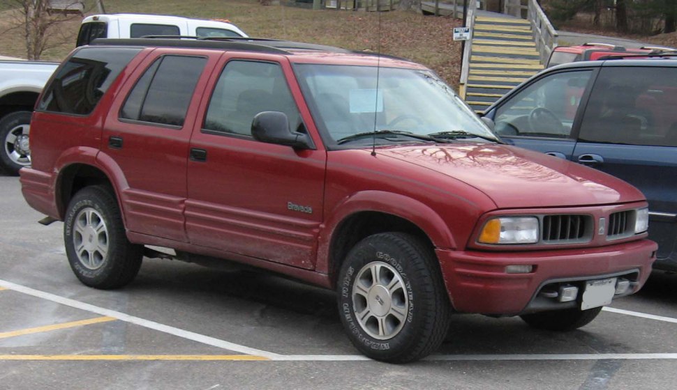 Red mid-90s SUV front side exterior with distinct body styling