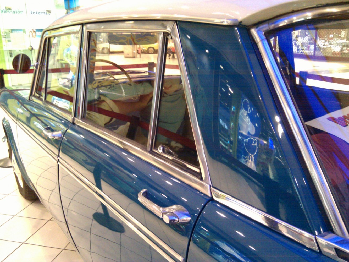Classic car door with chrome handle and vintage window design