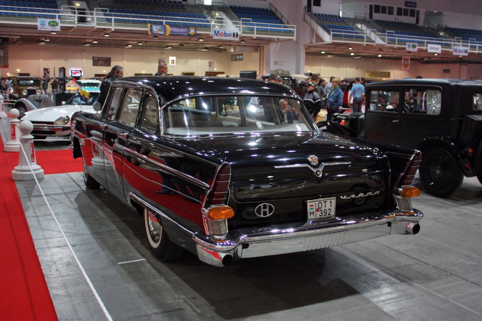 Classic black sedan with chrome bumper and distinct taillights