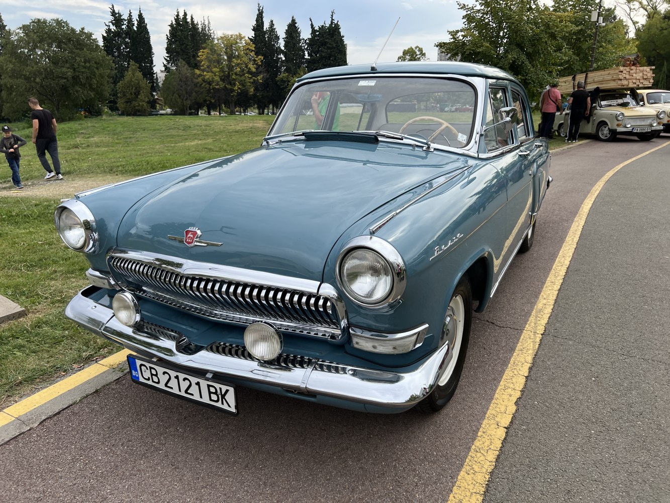 Vintage sedan with chrome grille and round headlights