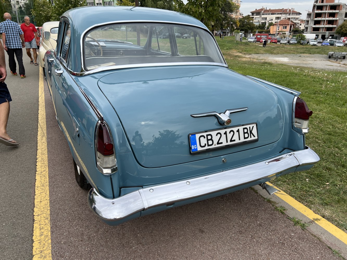 Rear view of a vintage sedan with chrome bumper and distinct tail fins