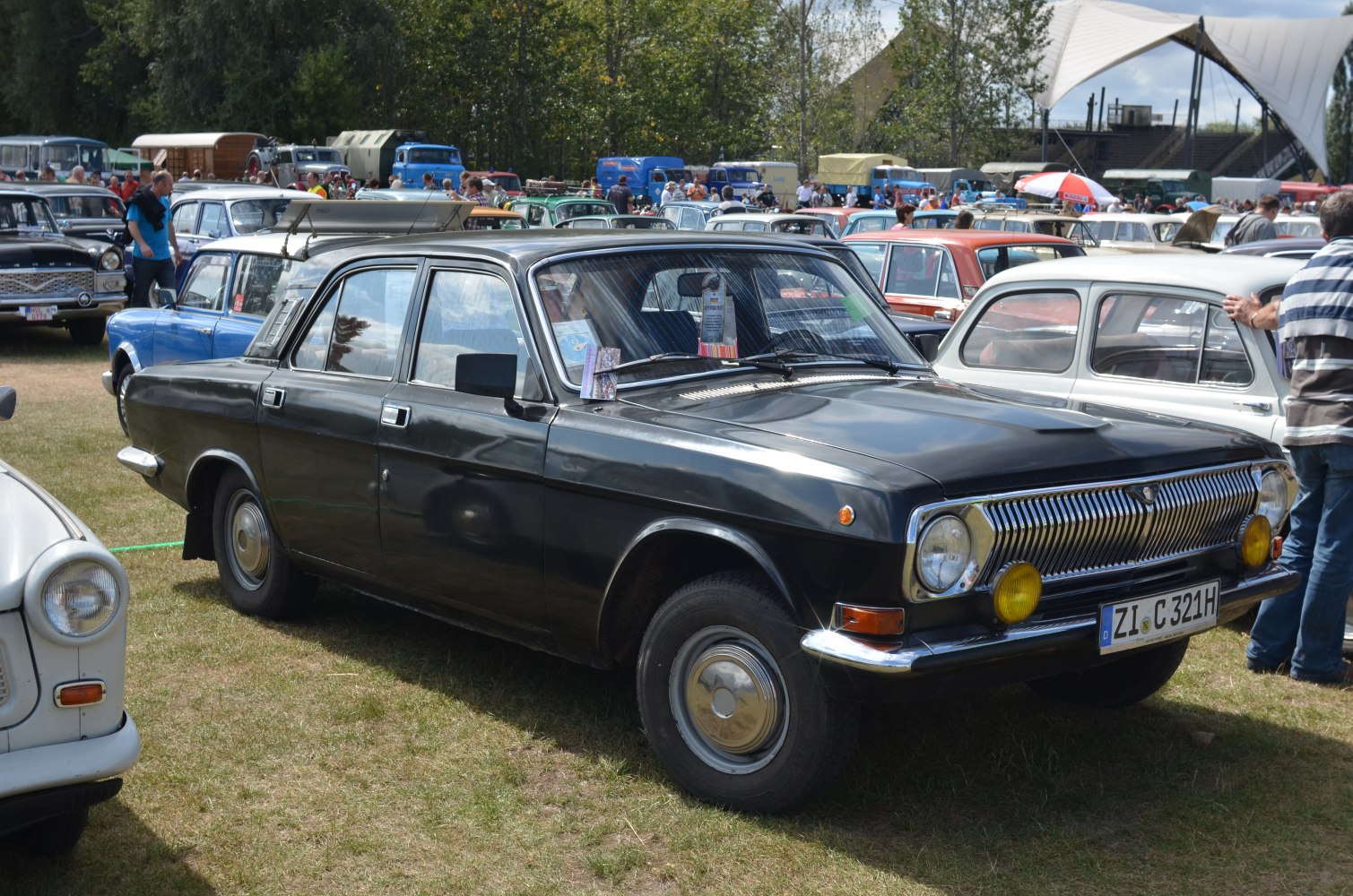 Vintage sedan with chrome grille and round headlights