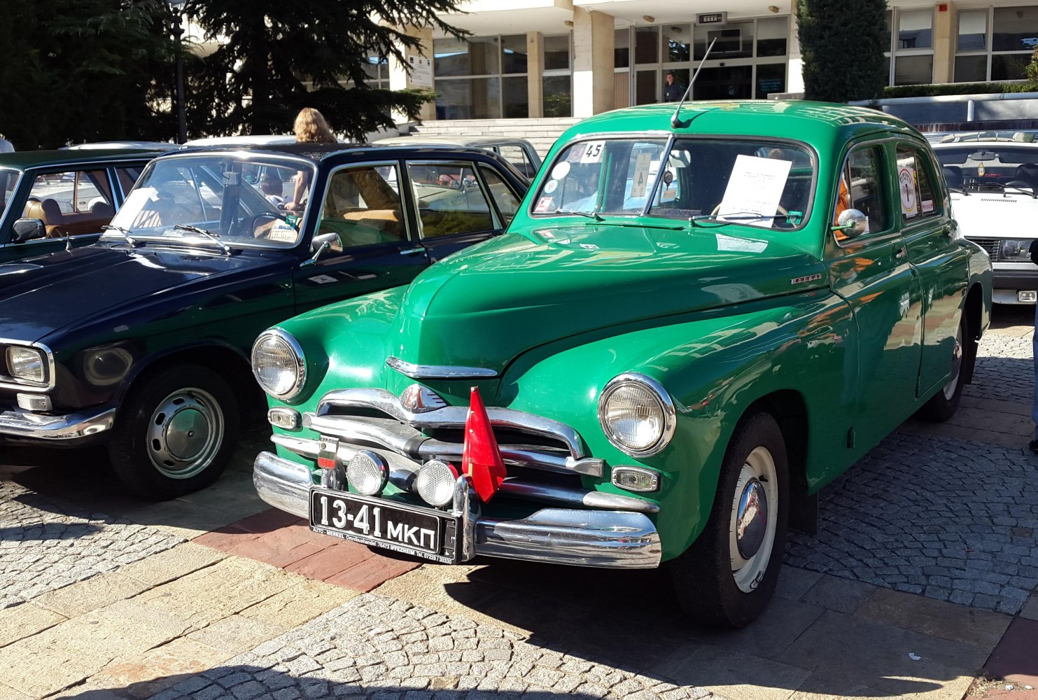 Vintage car with round headlights and chrome bumper