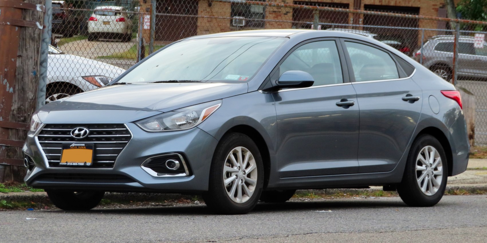 Sleek front side profile with angular headlights and distinct grille
