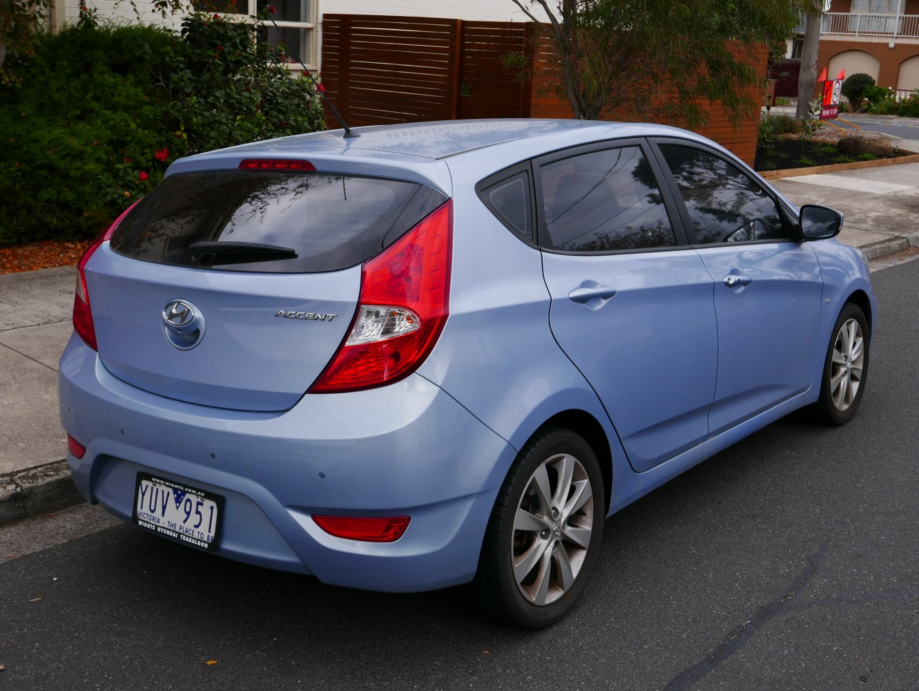 Rear view with distinct taillight and hatchback design