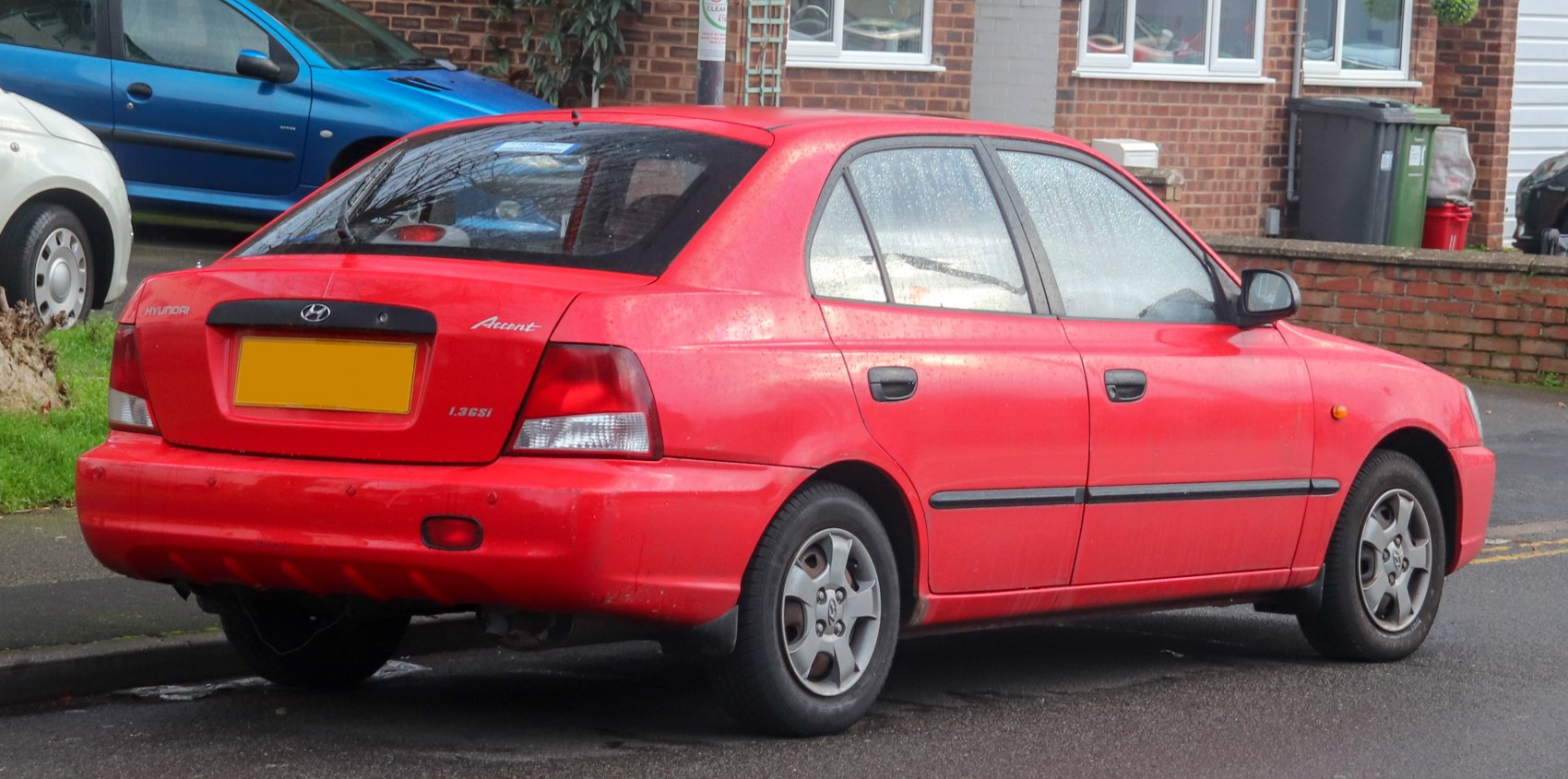Rear side view of a compact hatchback with distinctive taillights and design.