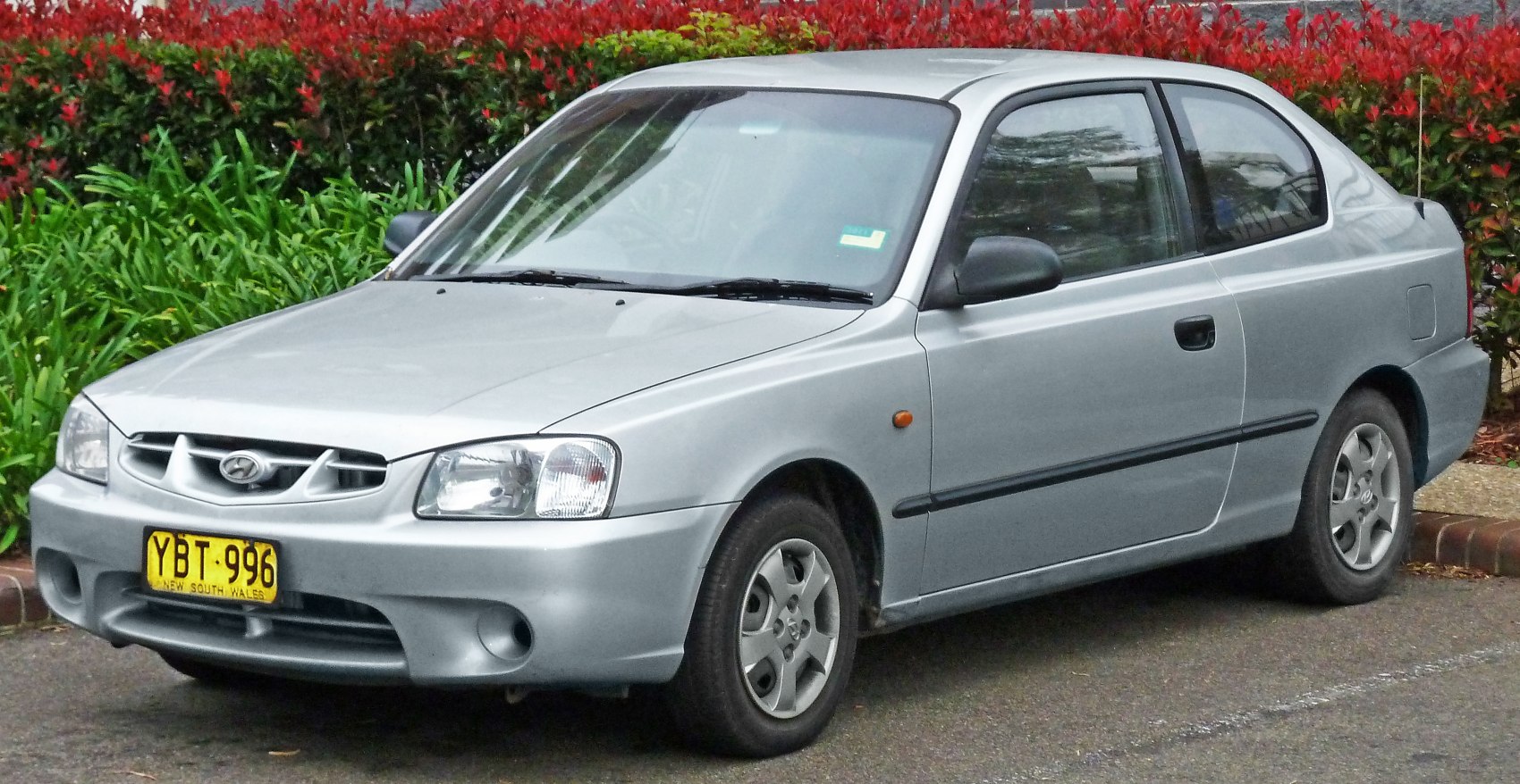 Silver compact sedan front and side view