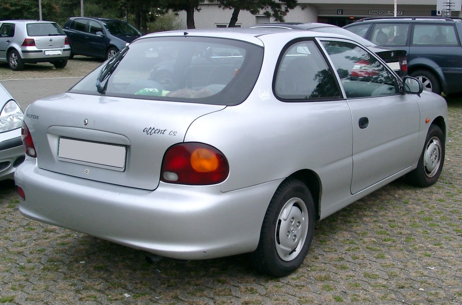 Rear view with round tail lights and smooth bumper of hatchback