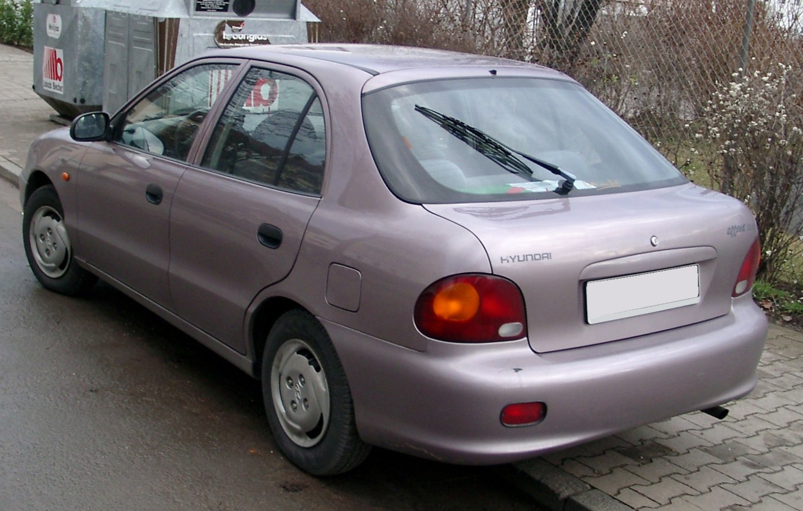 Rear and side profile with rounded taillights and rear wiper