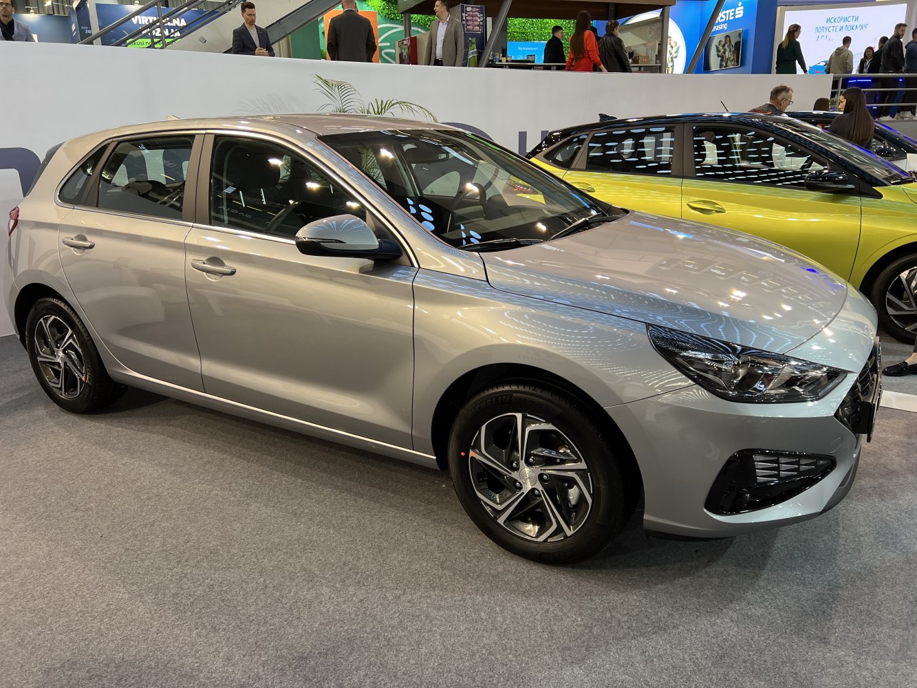 Silver hatchback highlighting front and side profile with alloy wheels