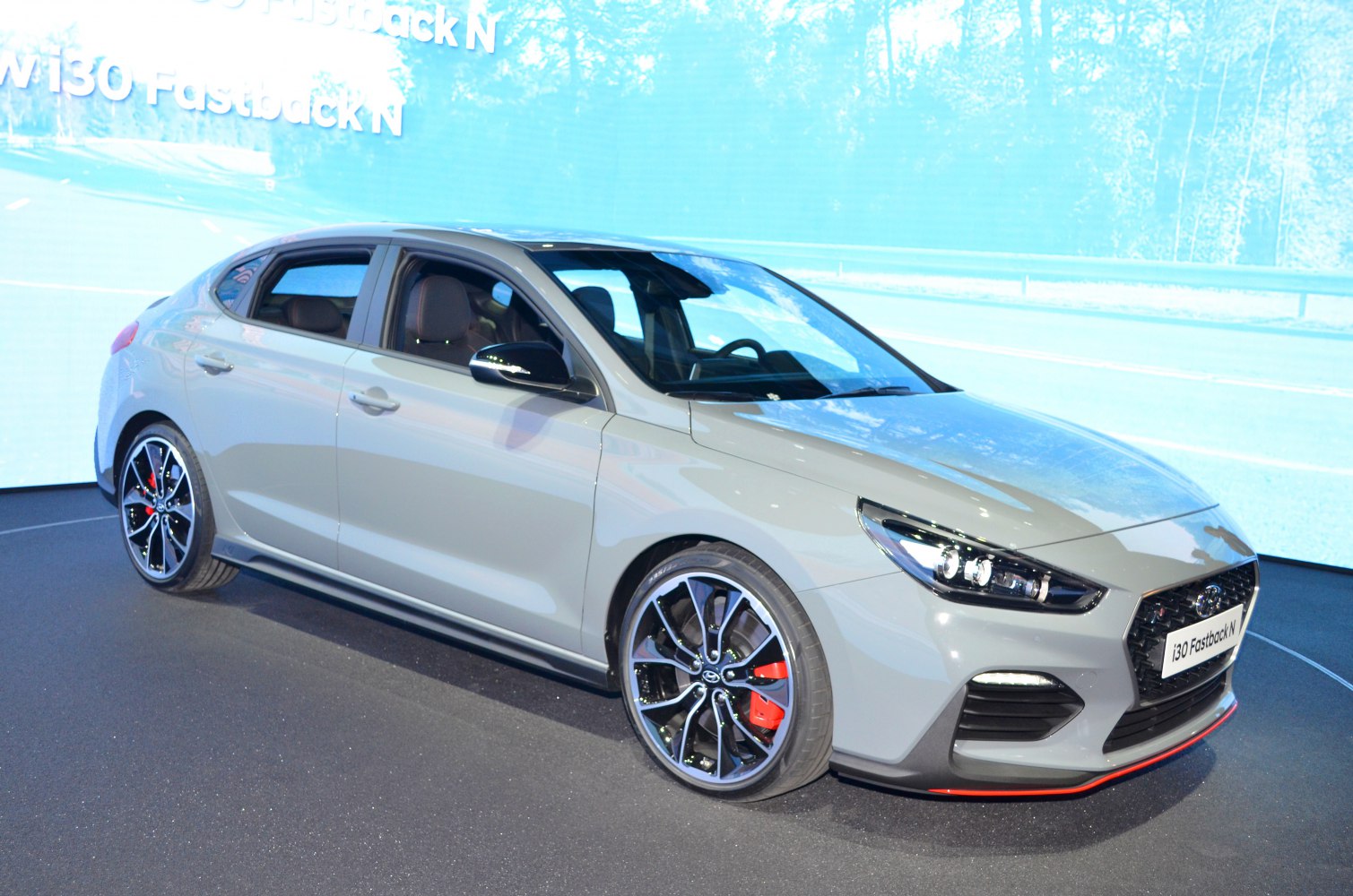 Sporty front side view with alloy wheels and red brake calipers