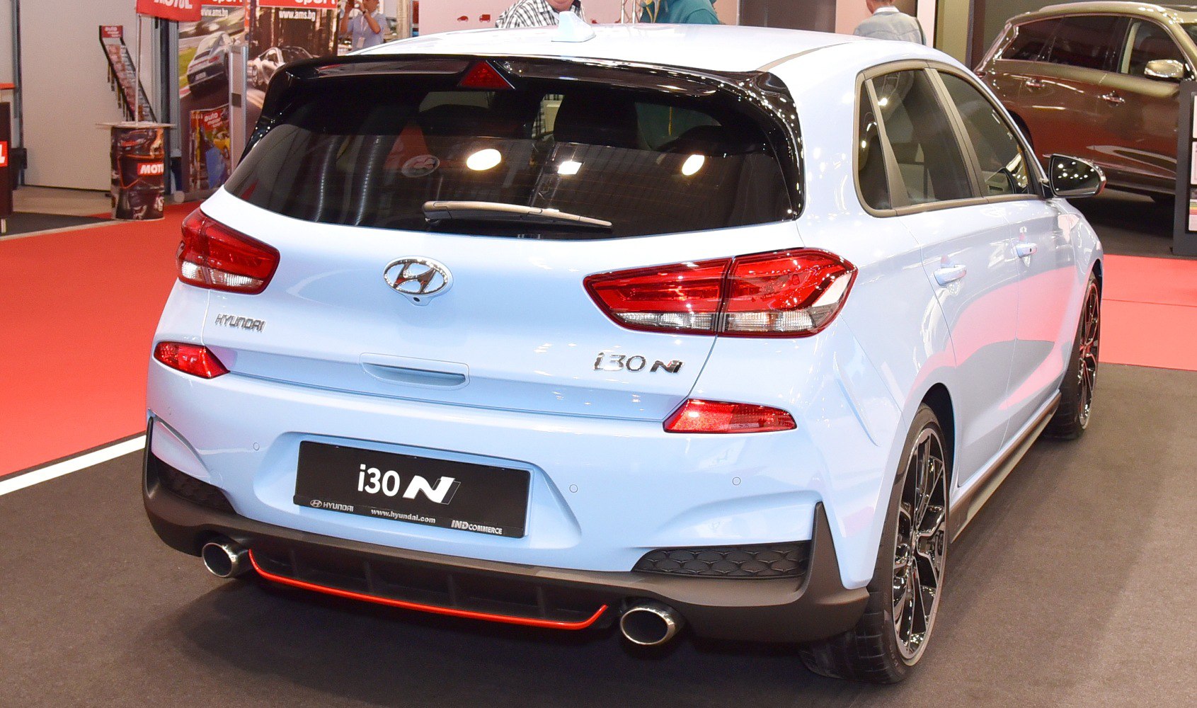 Sporty hatchback rear with dual exhaust and modern taillights