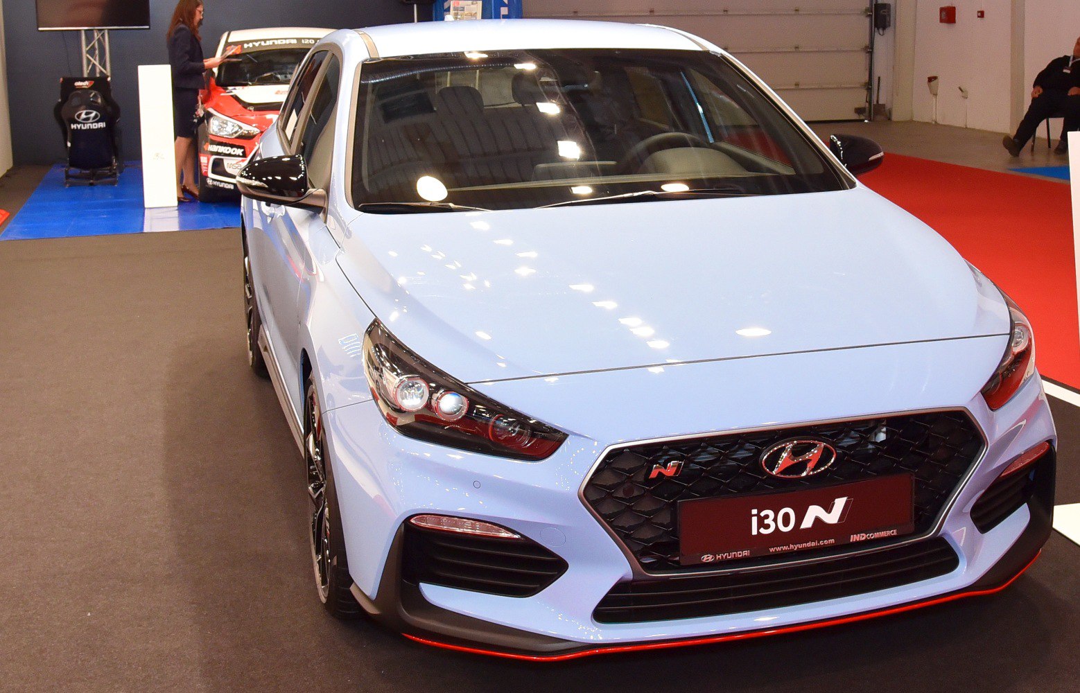 Front view highlighting sporty grille, headlights, and aerodynamic bumper.