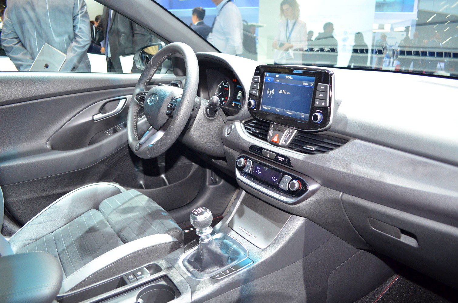 Touchscreen infotainment, manual gear shift, steering controls