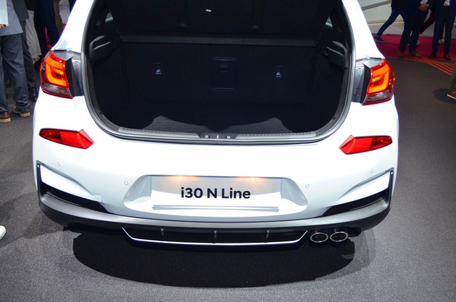 Open trunk of hatchback with dual exhaust and LED tail lights