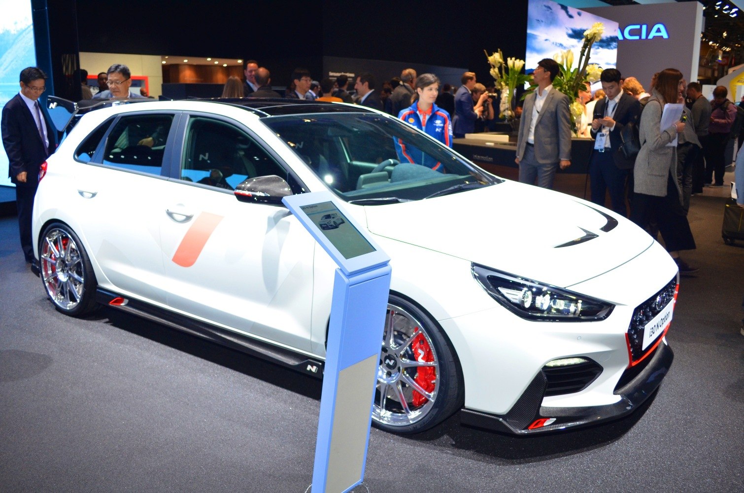 Sporty hatchback with red brake calipers and aggressive front design