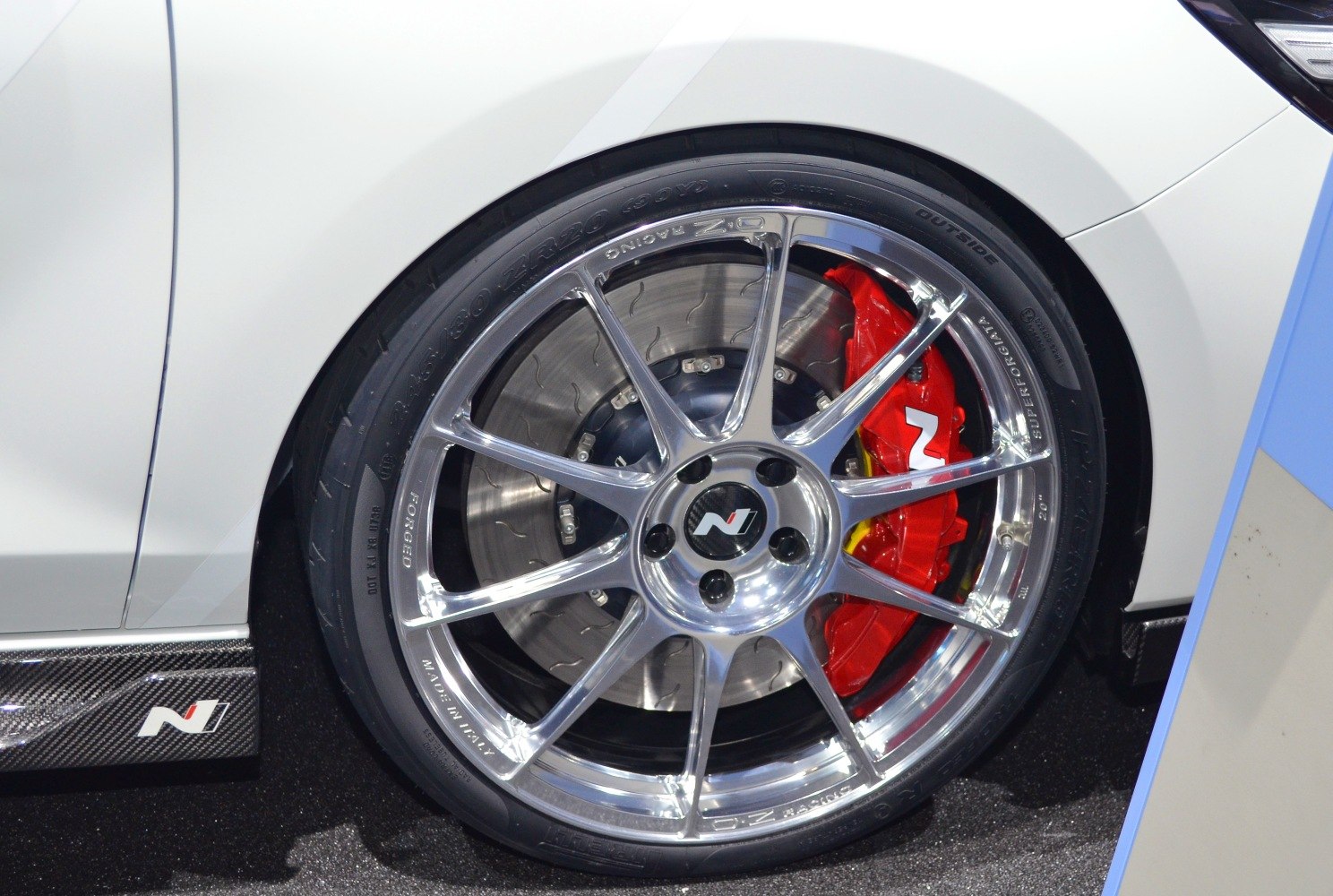 Forged alloy wheel with red performance brake caliper