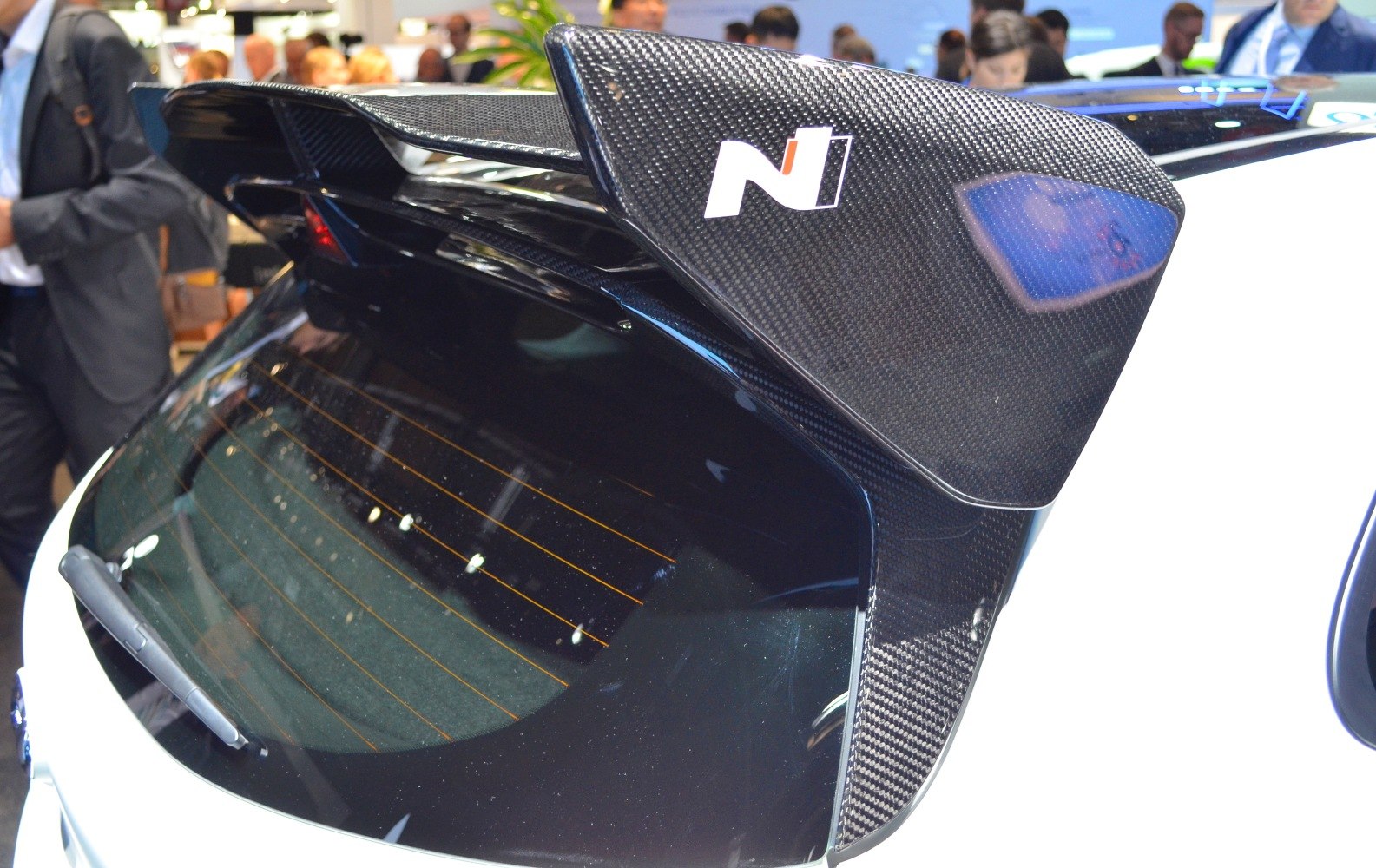 Carbon fiber rear spoiler with aerodynamic design