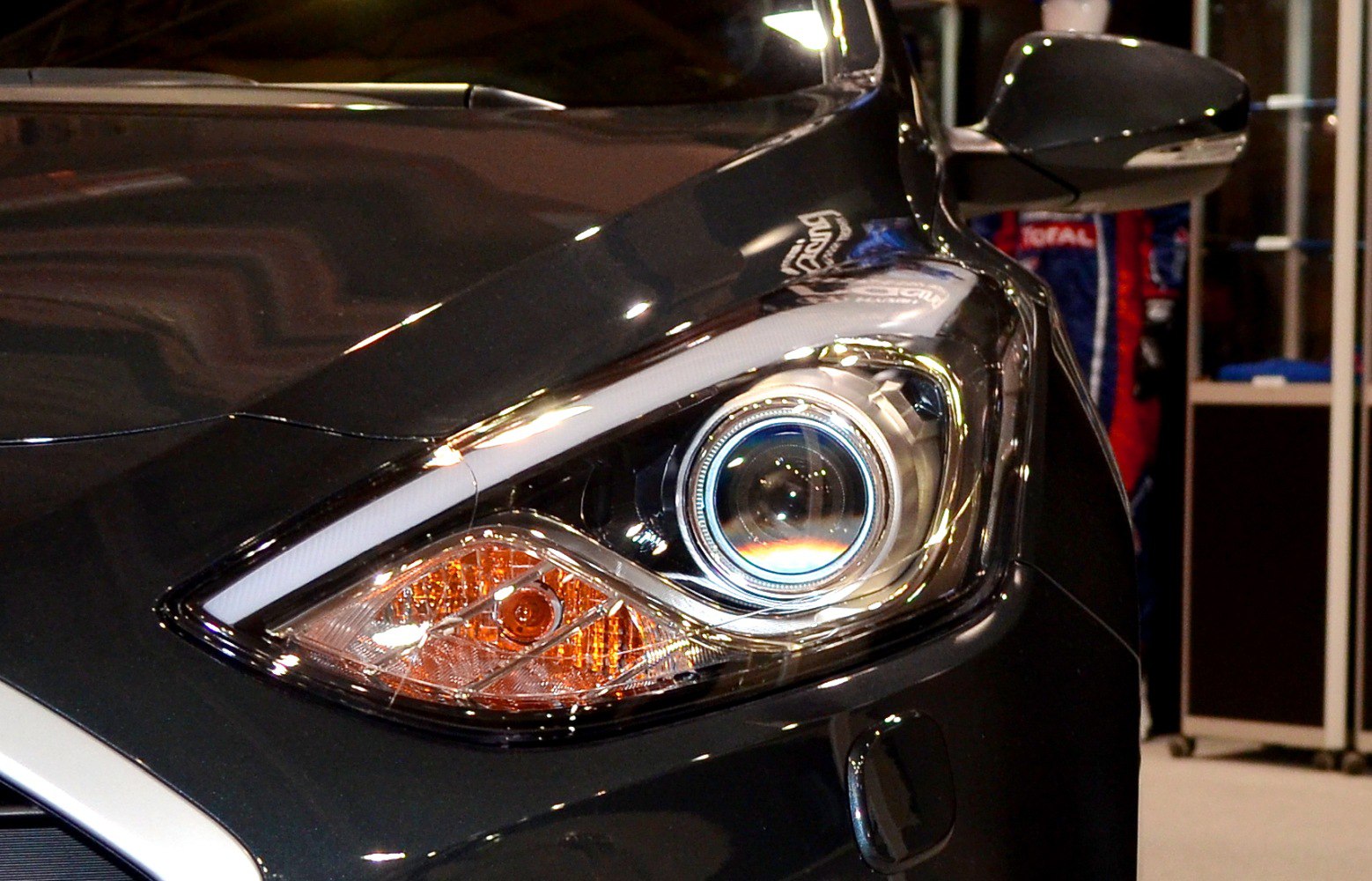 Close-up of modern car headlight and side mirror