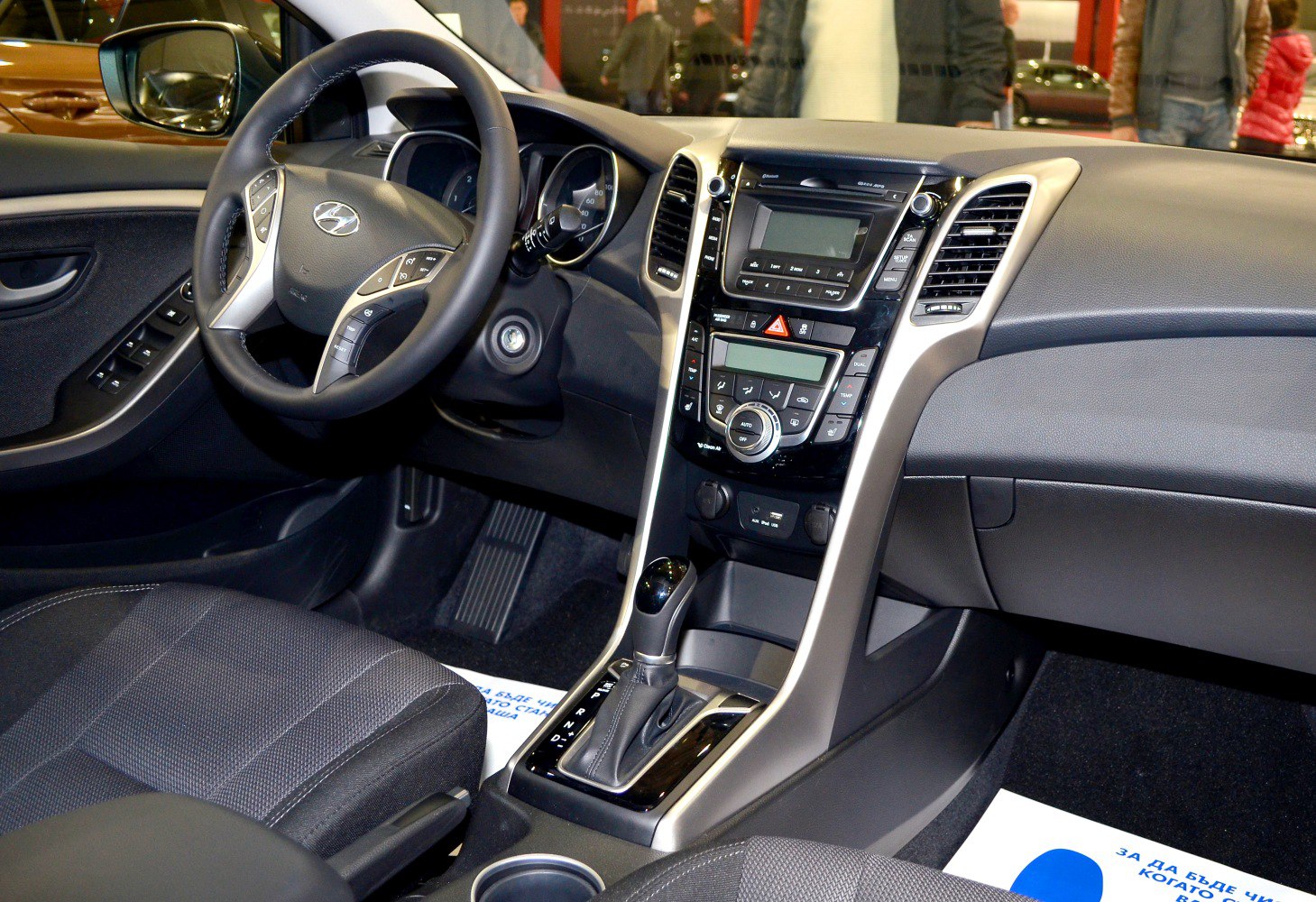 Dashboard, central console with climate control, and steering wheel with multifunction buttons