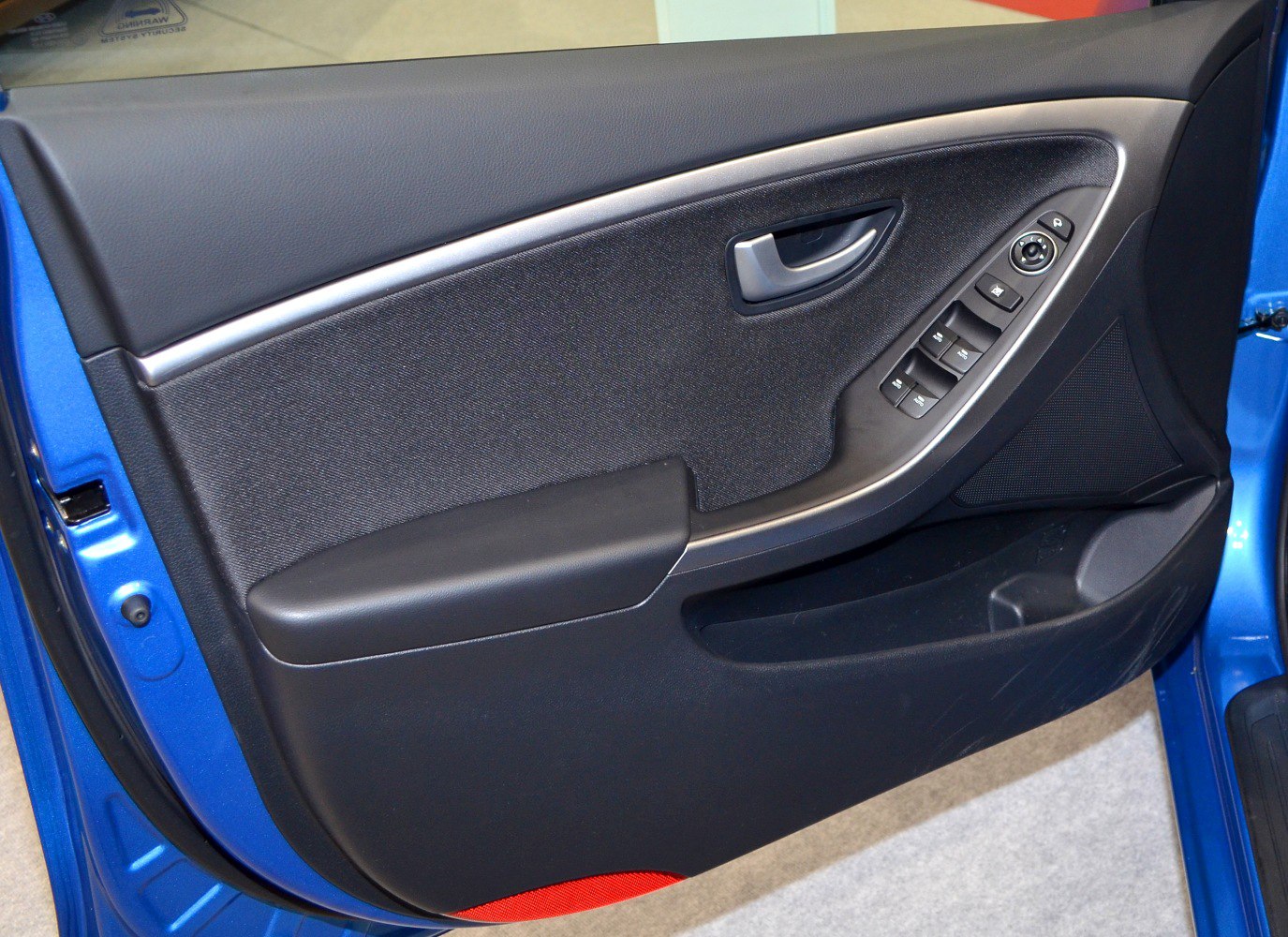 Side door interior panel with controls and handle