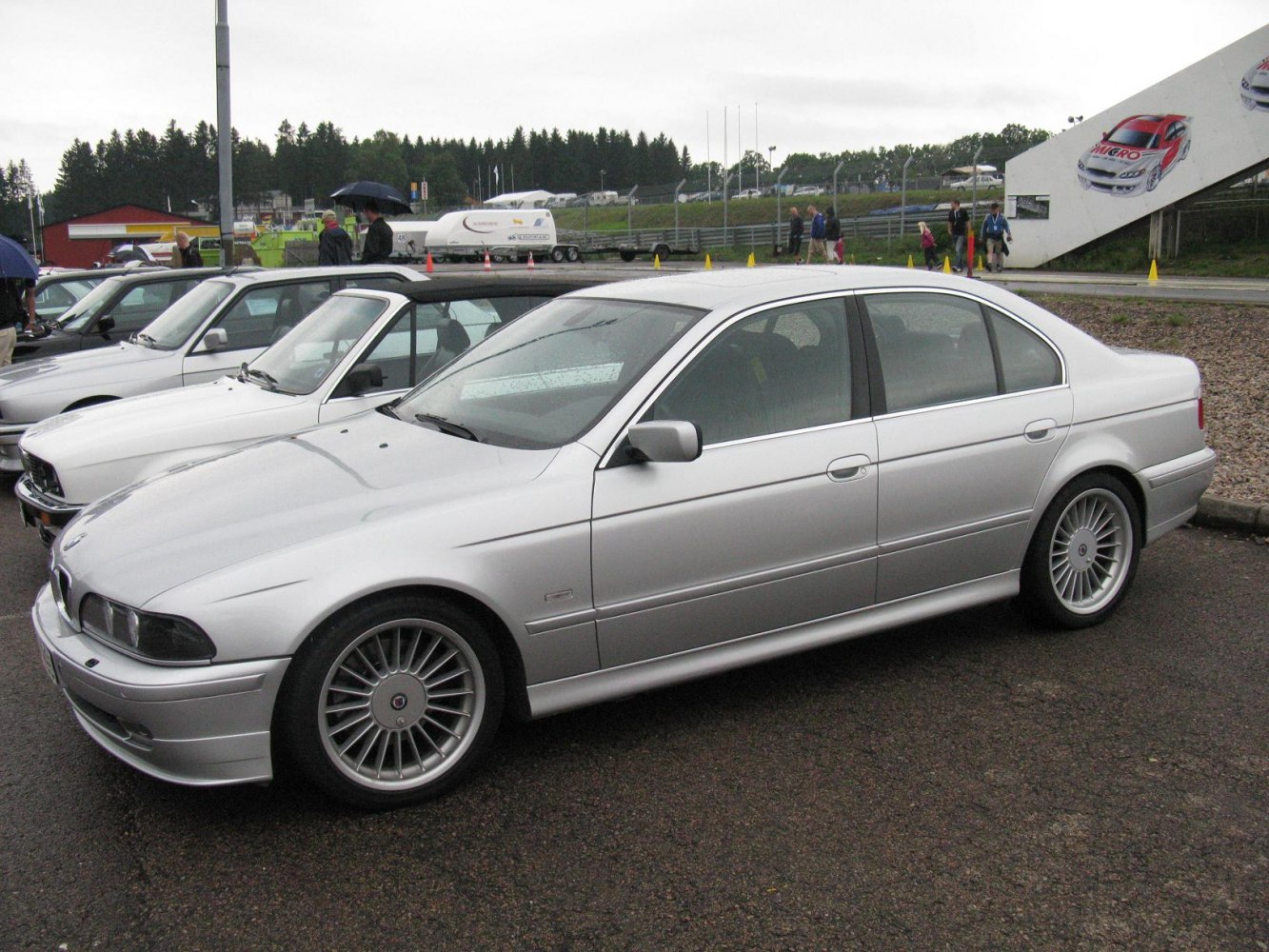 Silver sedan with multi-spoke alloy wheels and clean side profile